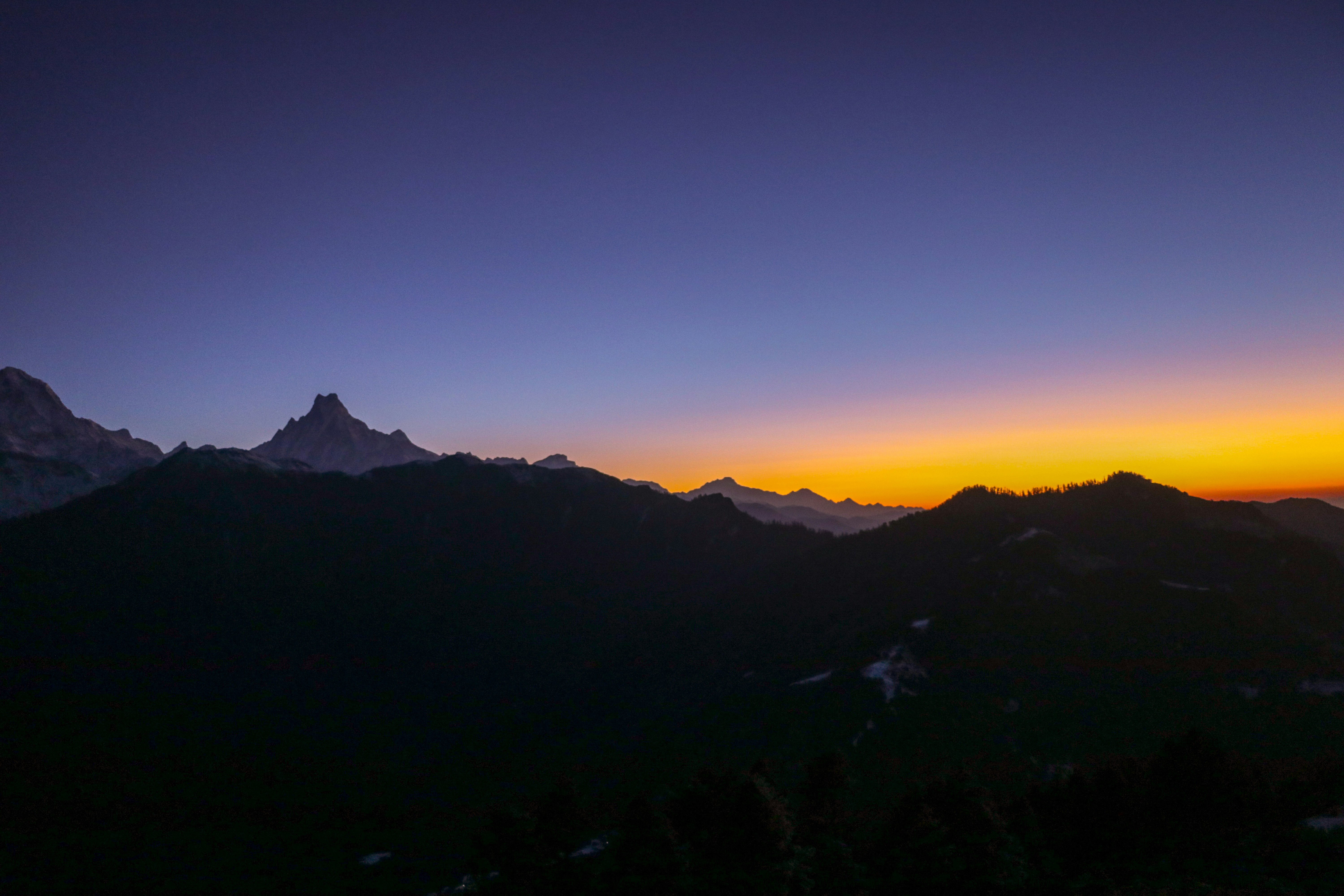 silhouette of mountains during golden hour